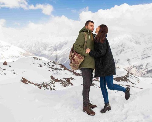young-beautiful-hipster-couple-hiking-mountains-winter-vacation-traveling-man-woman-love_11zon